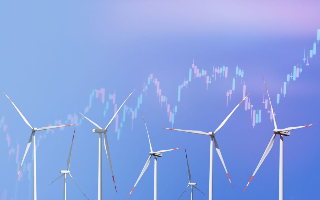 8 Windräder in unterschiedlichen Entfernungen vor blauem Himmel. Quer über das Foto verläuft ein leicht transparenter Graph in den Farben Rosa und blau.